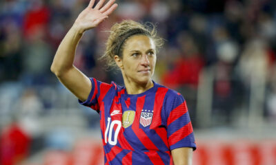 USWNT forward Carli Lloyd waves to the crowd.