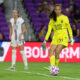 Phallon Tullis-Joyce passes the ball for the Seattle Reign during a game against the Orlando Pride in 2023.